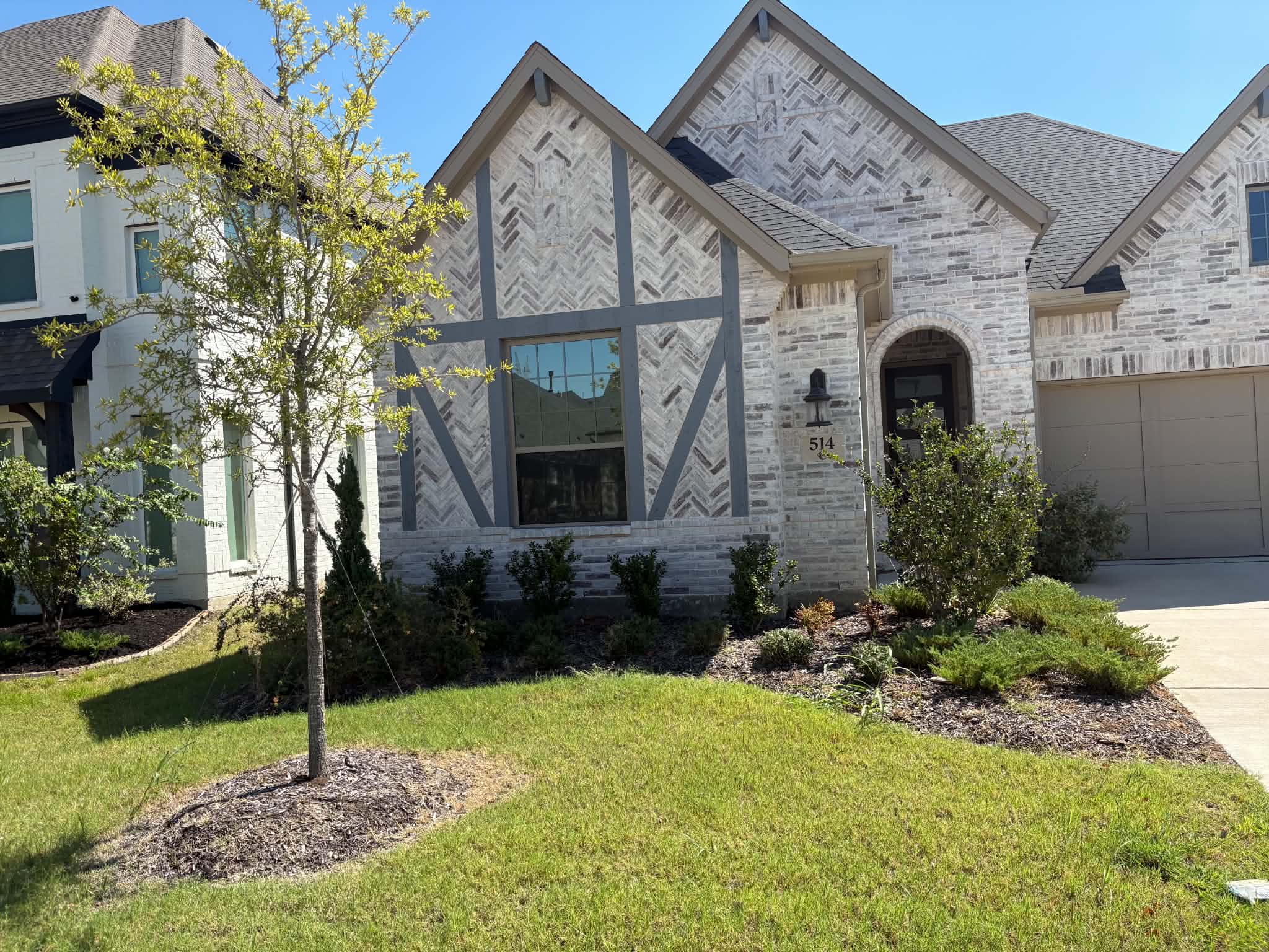 Front yard before landscaping with original mulch beds