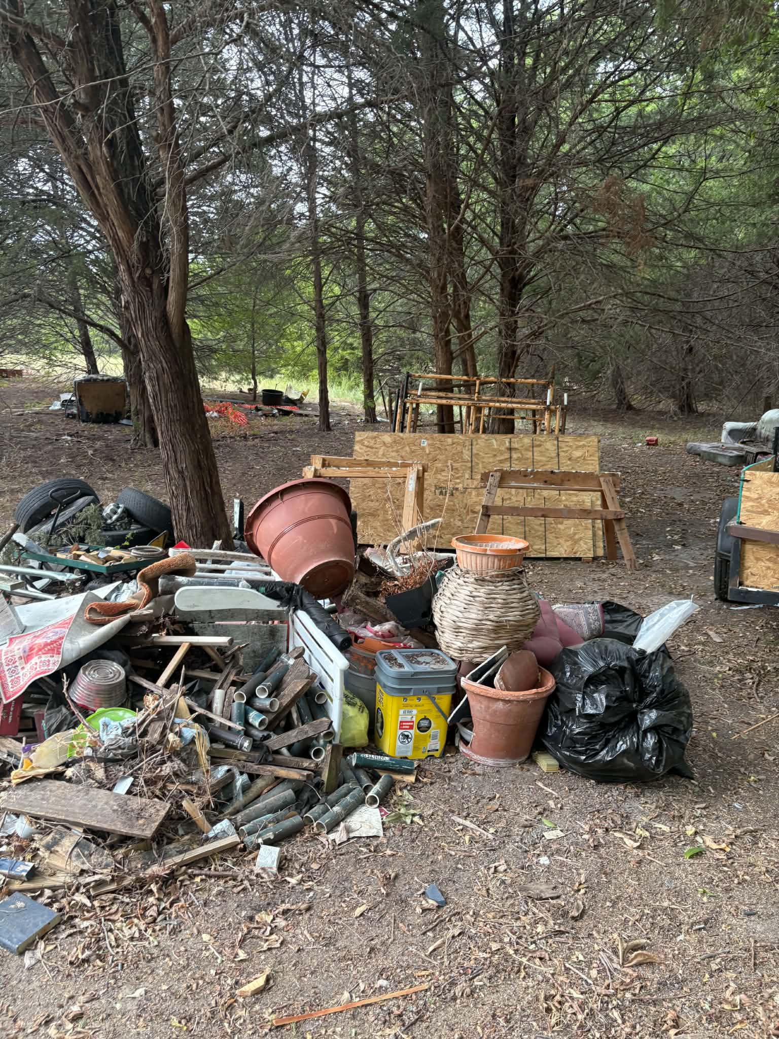 Outdoor area with piled unwanted objects and debris